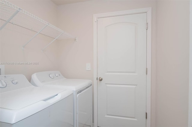 laundry room featuring laundry area and washing machine and clothes dryer