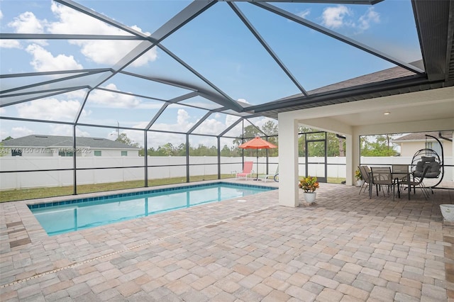 view of swimming pool featuring a patio area, fence, and a fenced in pool