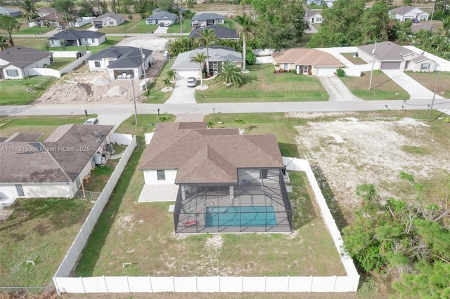 birds eye view of property with a residential view