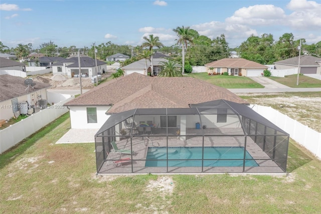 view of pool with a residential view, a patio area, and a fenced backyard