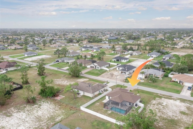 birds eye view of property with a residential view