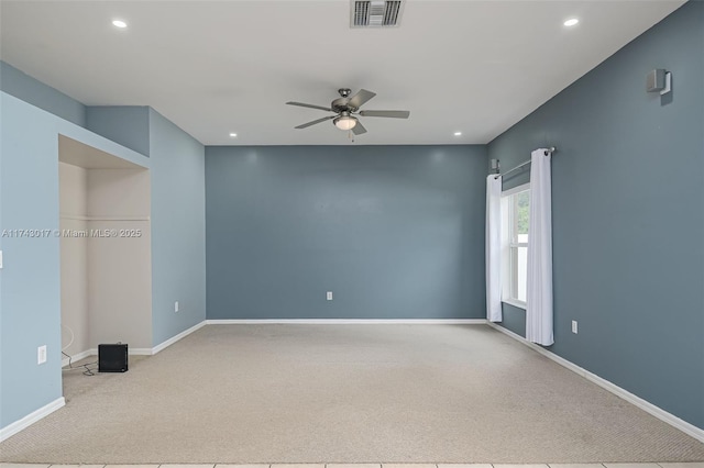 carpeted empty room featuring ceiling fan