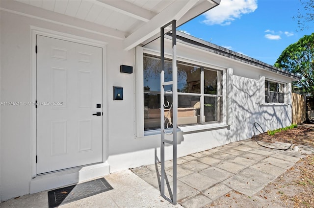 property entrance with a patio