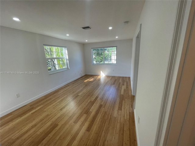 empty room with light hardwood / wood-style floors