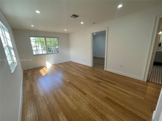 unfurnished room featuring light hardwood / wood-style floors