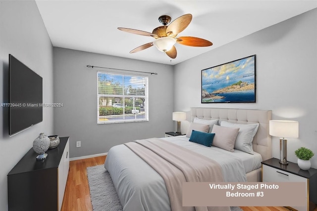 bedroom featuring light hardwood / wood-style floors and ceiling fan