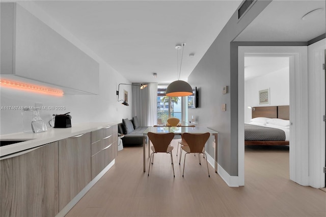 dining space featuring light hardwood / wood-style flooring