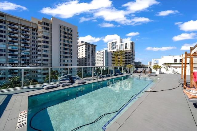 view of swimming pool with a patio