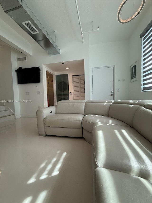 living room with concrete flooring