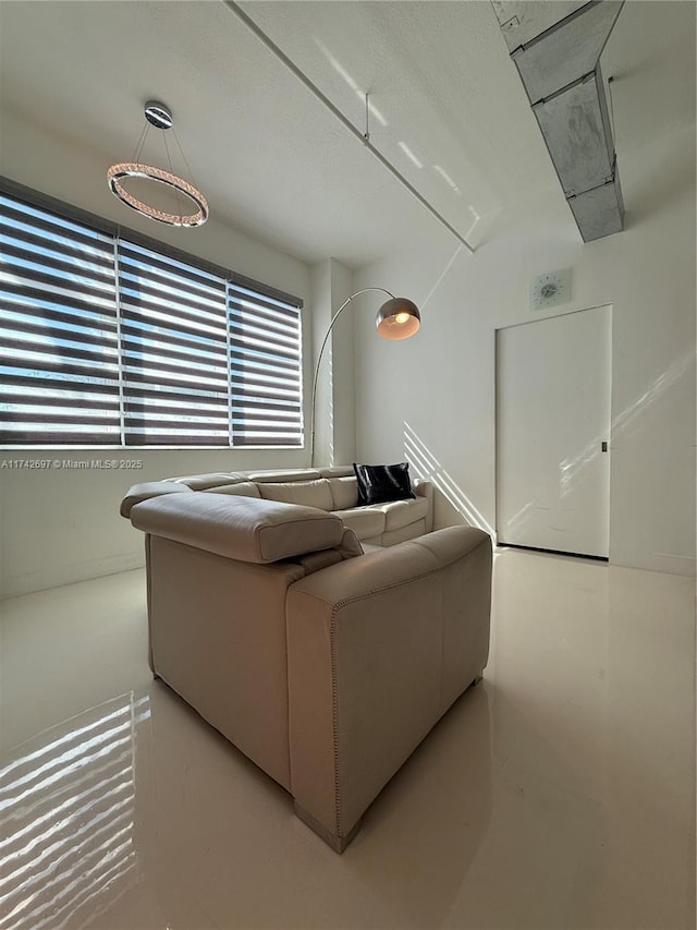 living room featuring concrete flooring