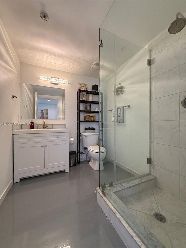 bathroom with vanity, a shower with door, toilet, and concrete floors