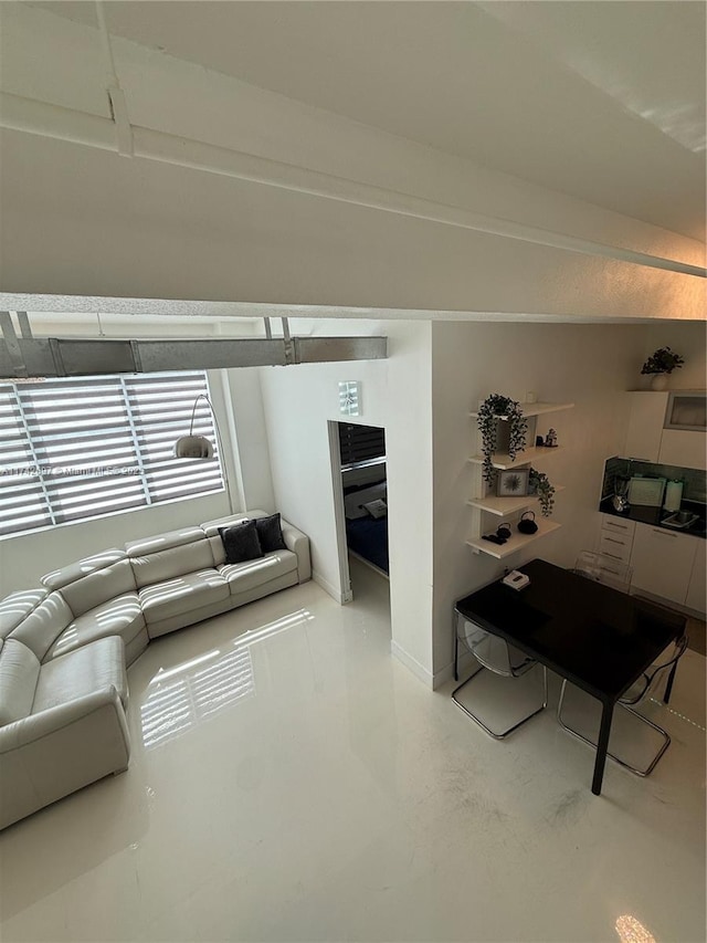 living room featuring concrete floors