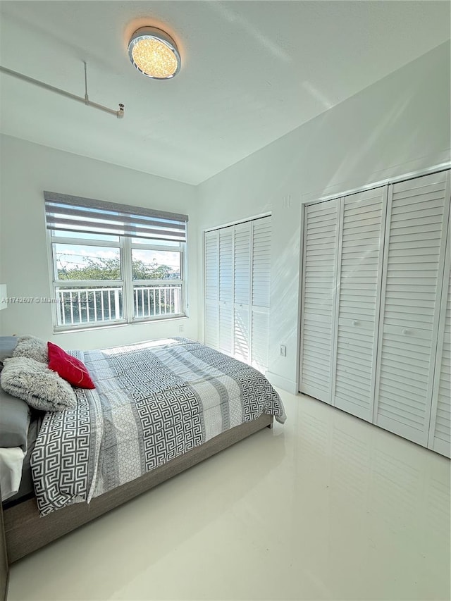 bedroom with two closets