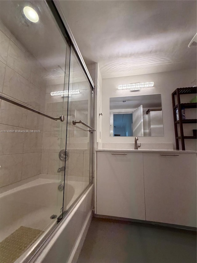 bathroom with sink and shower / bath combination with glass door