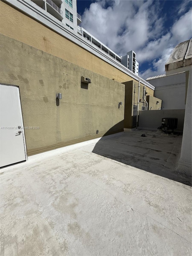 view of side of home featuring a patio