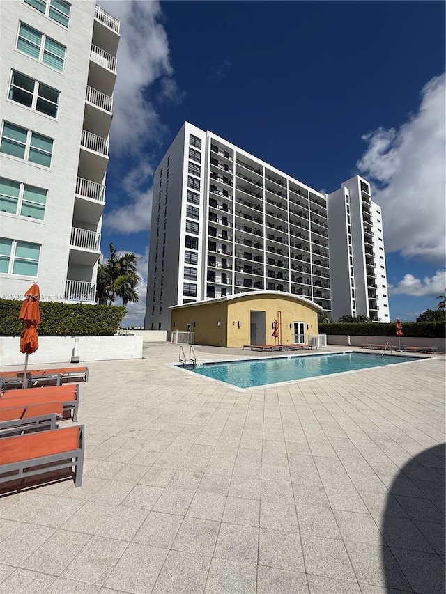 view of swimming pool featuring a patio area