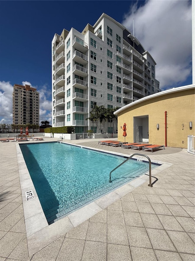 view of swimming pool with a patio