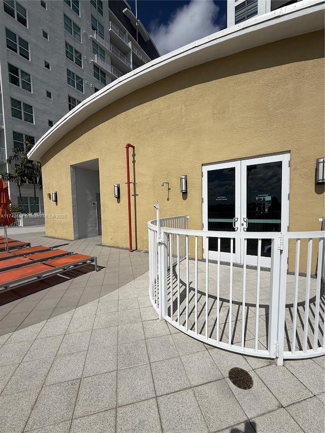 property entrance featuring french doors