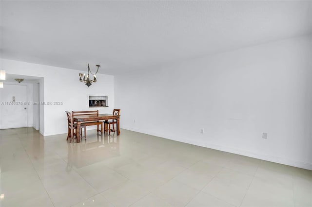 dining space featuring a chandelier