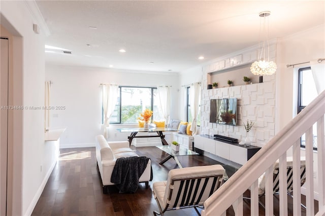 living room with ornamental molding and hardwood / wood-style floors