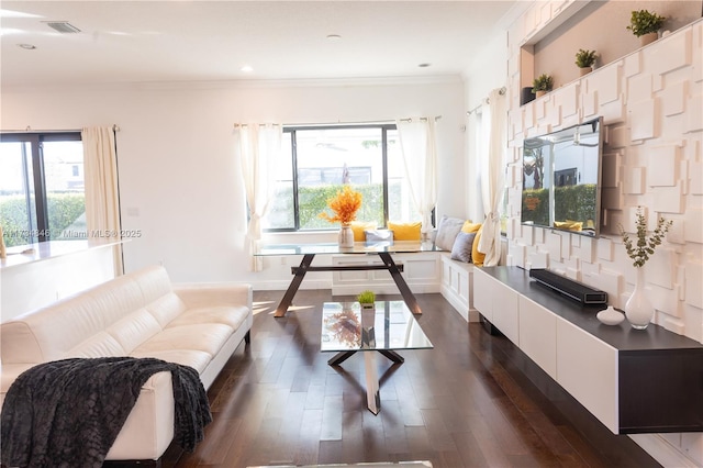 living room with ornamental molding, breakfast area, and dark hardwood / wood-style flooring