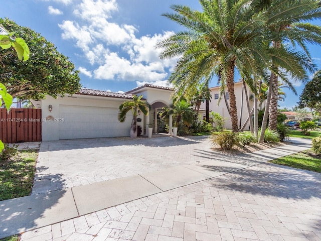 mediterranean / spanish-style house featuring a garage