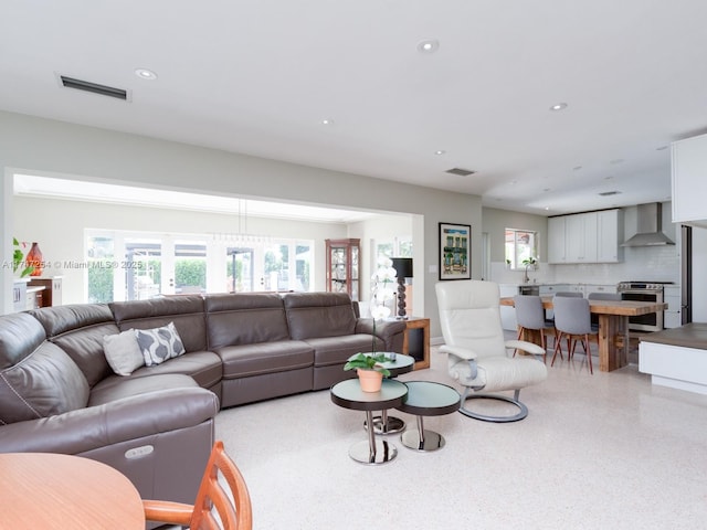 living room featuring plenty of natural light and sink