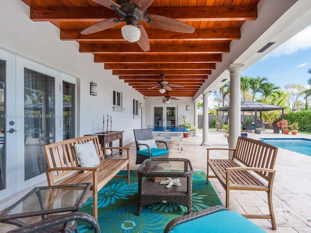 view of patio / terrace with ceiling fan, outdoor lounge area, and french doors