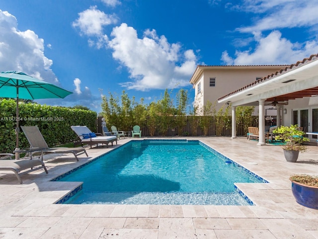 view of pool featuring a patio and ceiling fan