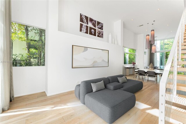 335 W 46th St, Miami Beach, FL 33140 - living room with a high ceiling and hardwood / wood-style floors