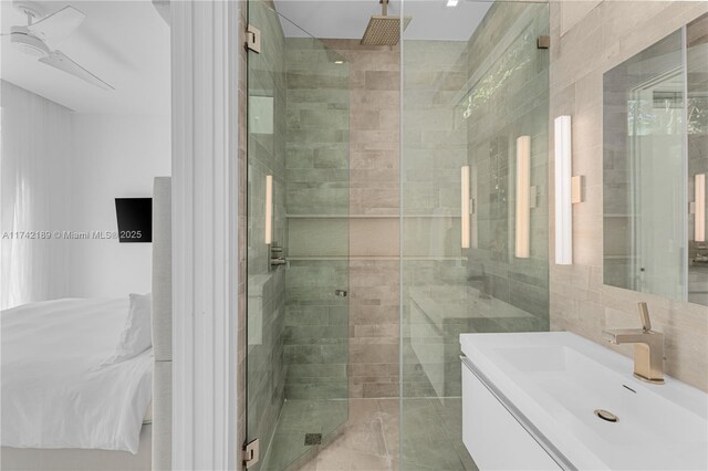335 W 46th St, Miami Beach, FL 33140 - bathroom featuring tile walls, an enclosed shower, and vanity