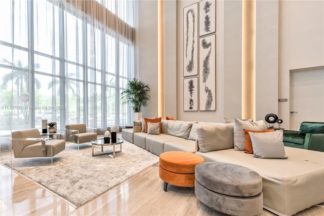 lobby with a high ceiling and a wall of windows