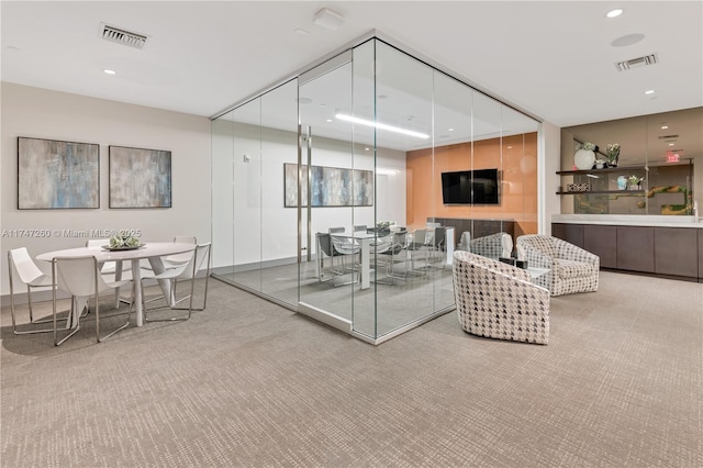 living area with carpet floors and recessed lighting