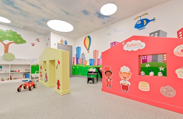 playroom featuring carpet flooring and baseboards