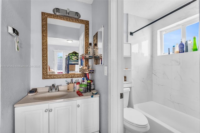 full bathroom featuring toilet, shower / bathing tub combination, and vanity
