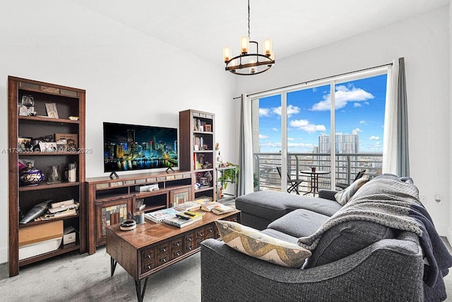 carpeted living room featuring a chandelier