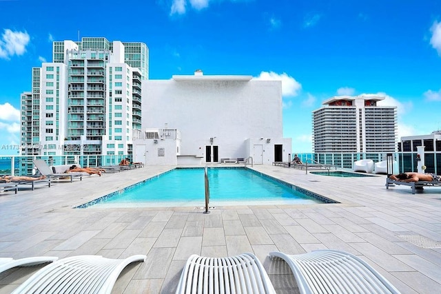 view of pool featuring a patio