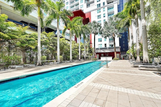 view of swimming pool with a patio area