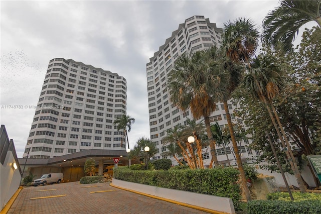 view of building exterior featuring uncovered parking