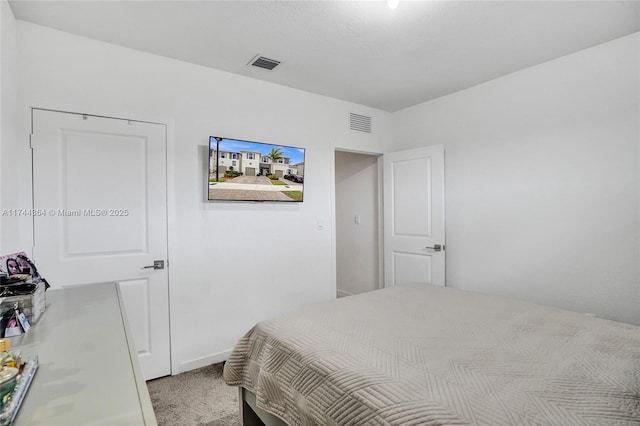 bedroom featuring carpet and visible vents