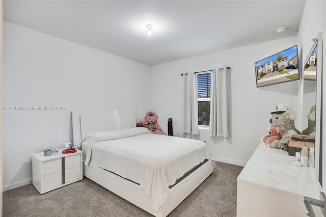 carpeted bedroom with baseboards