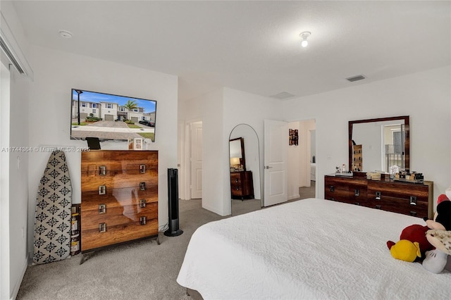 bedroom featuring carpet floors and visible vents