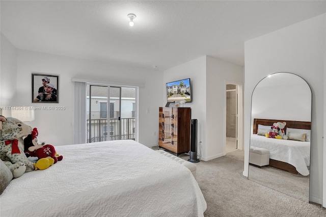 carpeted bedroom with access to outside and baseboards