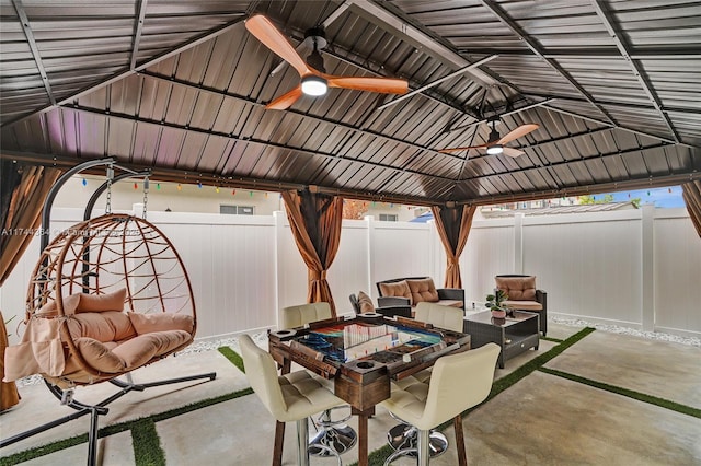 view of patio / terrace featuring a gazebo, a fenced backyard, and a ceiling fan