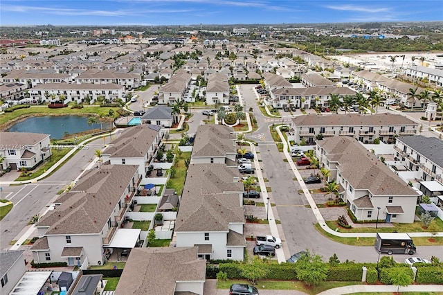 aerial view with a residential view and a water view