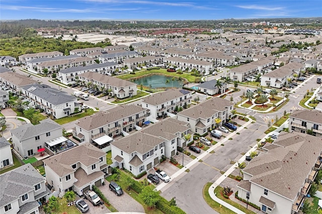 bird's eye view featuring a water view and a residential view