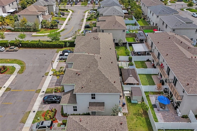 birds eye view of property with a residential view