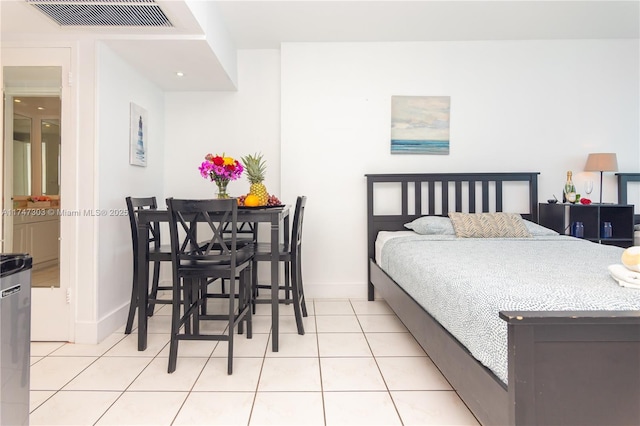 bedroom featuring light tile patterned floors