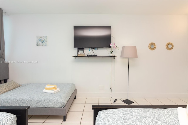 bedroom with light tile patterned flooring