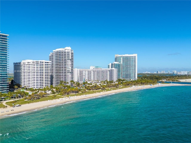 birds eye view of property featuring a water view and a view of the beach